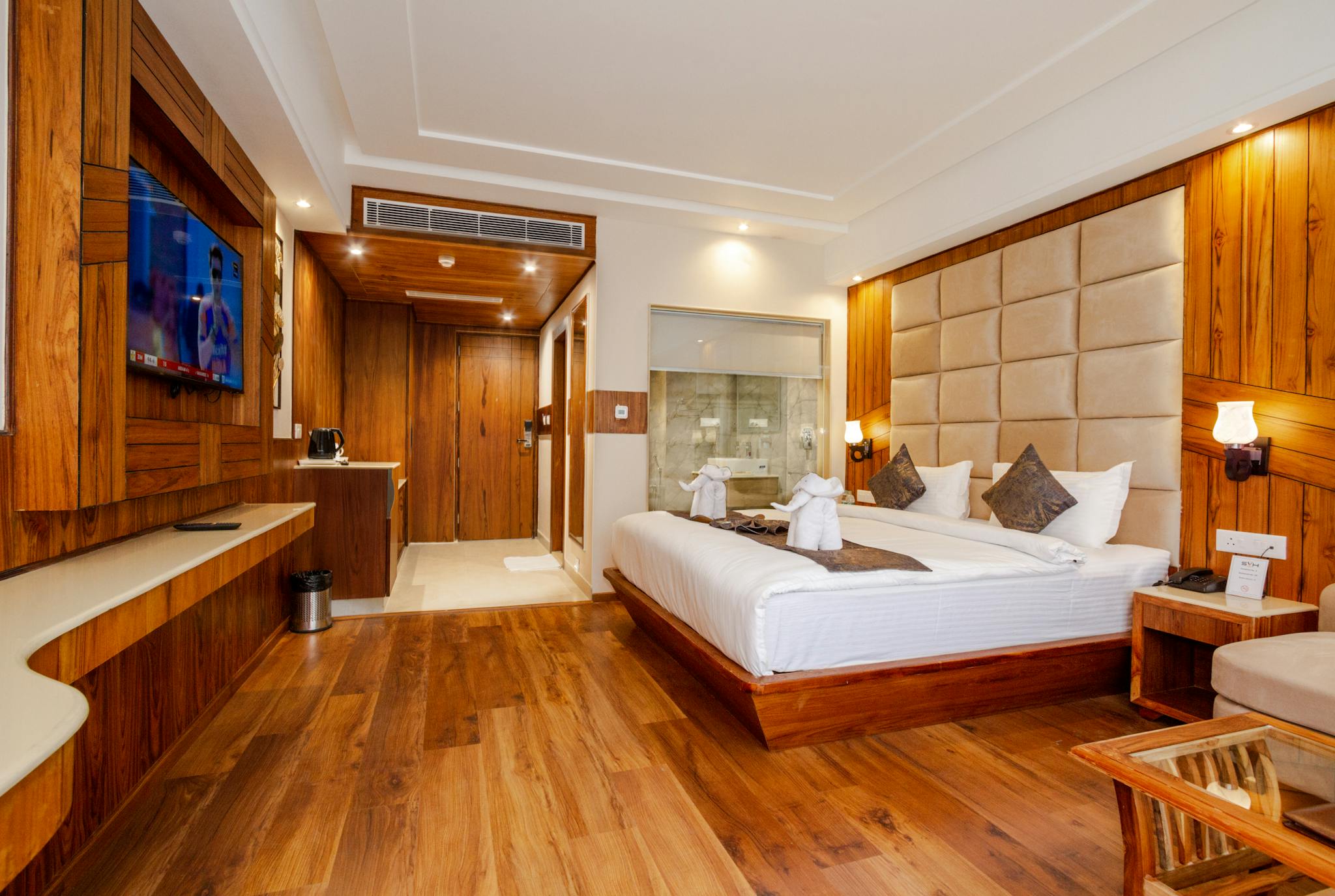 Elegant Hotel Room Featuring Wooden Decor A