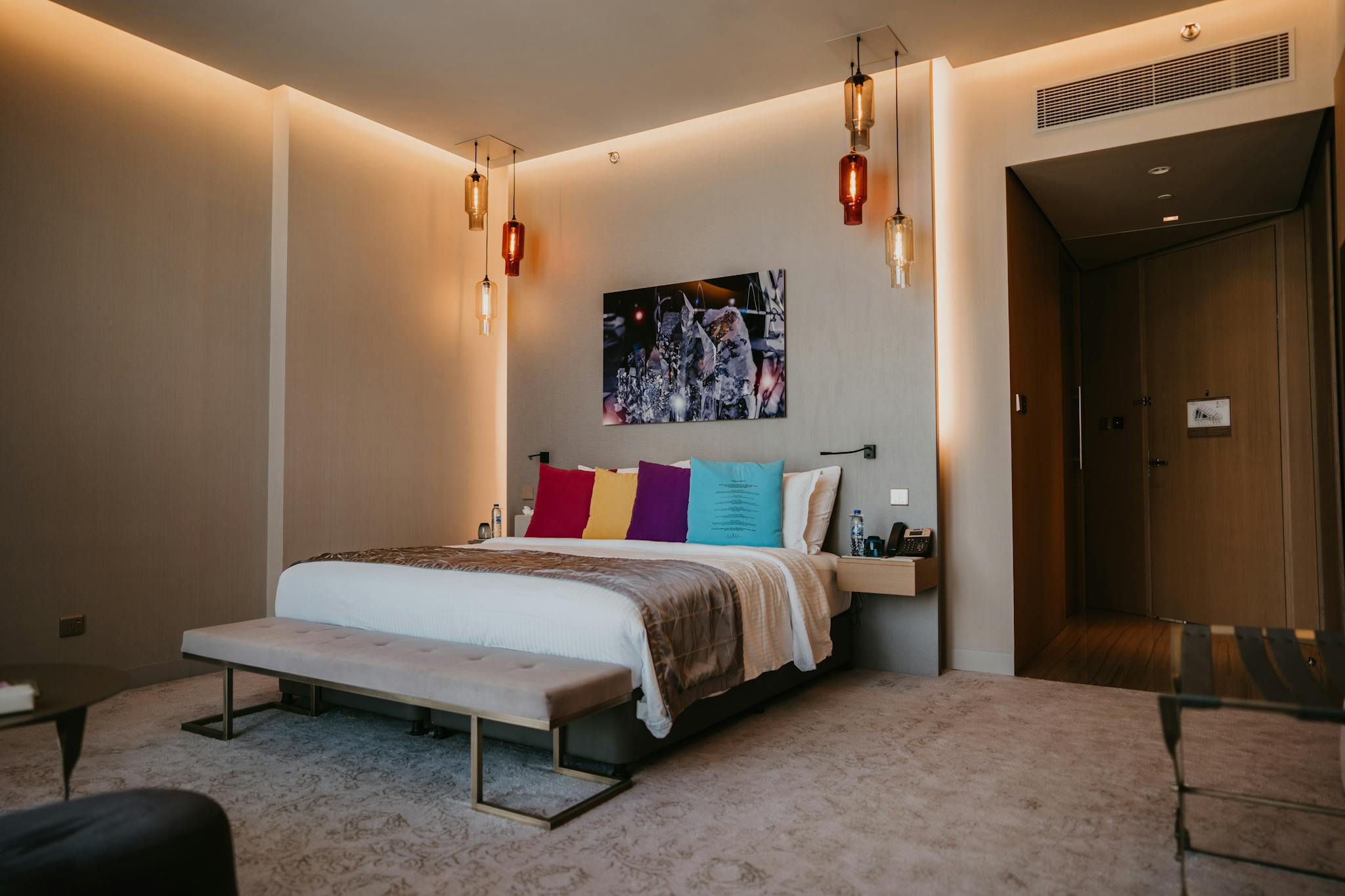 Spacious Modern Bedroom With Colorful Pillows And