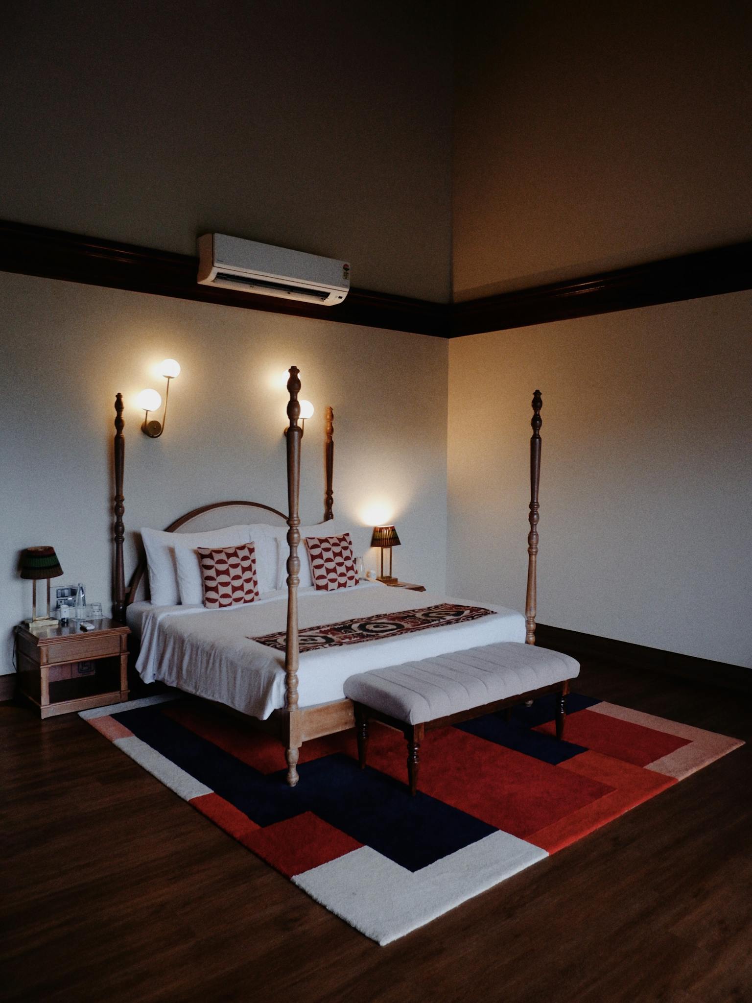 Warmly Lit Bedroom With Four Poster Bed And